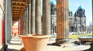 The Berlin Cathedral or, Berliner Dom, seen through the columns of the Altes Museum