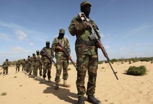 Members of Somalia's Al Shabaab militant group parade during a demonstration to announce their integration with al Qaeda, in Elasha, south of the capital Mogadishu February 13, 2012. Picture taken February 13, 2012.