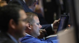 Traders work on the floor of the New York Stock Exchange