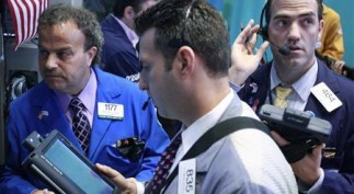 Traders work on the floor of the New York Stock Exchange