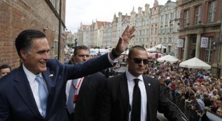 U.S. Republican Presidential candidate Romney waves to hundreds of people gathered outside before his meeting with Poland's PM Tusk at the Old Town Hall in Gdansk