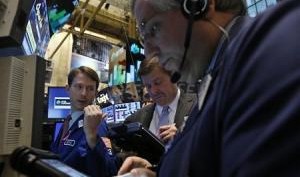Traders work on the floor of the New York Stock Exchange