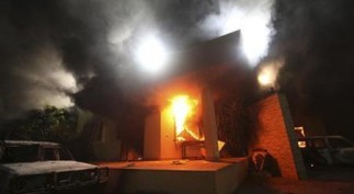 The U.S. Consulate in Benghazi is seen in flames during a protest