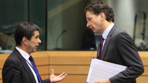 Portugal's Finance Minister Gaspar talks with Dutch Finance Minister Dijsselbloem during Eurogroup meeting in Brussels