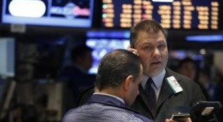 Traders work on the floor of the New York Stock Exchange