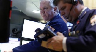 Traders work on the floor at the New York Stock Exchange
