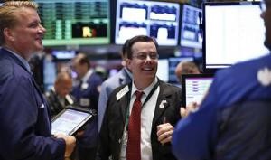 Traders work on the floor at the New York Stock Exchange