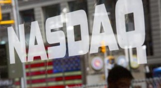 A man walks past the Nasdaq MarketSite in New York's Times Square