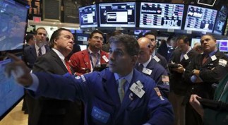 Traders work on the floor of the New York Stock Exchange