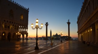 Sunrise at the San Marco Basilica and Doges Palace in the Piazza San Marco overlooking The Grand Canal.