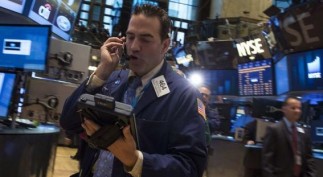 Traders work on the floor of the New York Stock Exchange